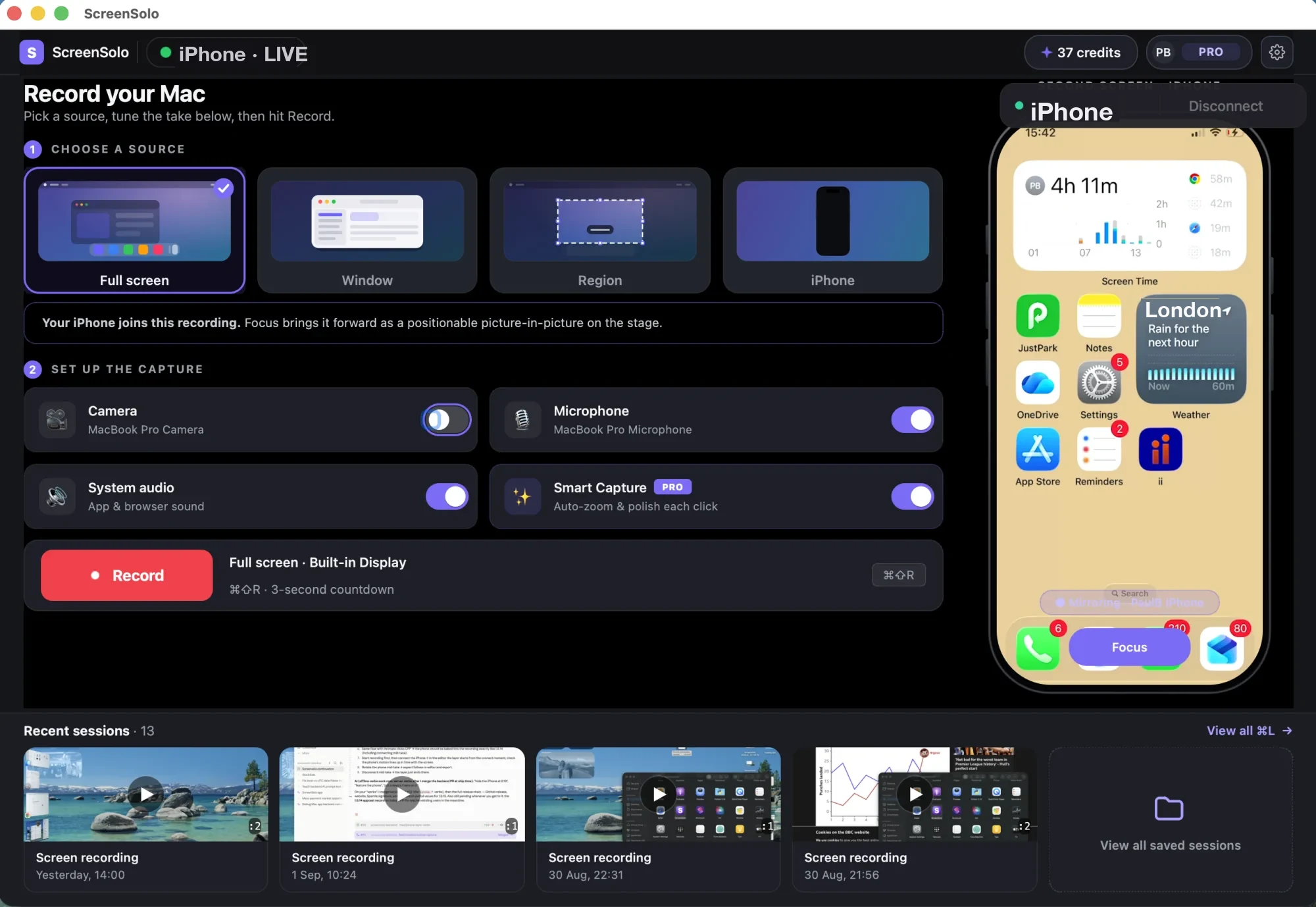 The ScreenSolo window. Four sources across the top — full screen, a window, a region, and iPhone — with full screen chosen. Below them, switches for the camera, microphone, system audio and Smart Capture, and a red Record button. An iPhone is mirrored live down the right-hand side, and a shelf of recent recordings runs along the bottom.